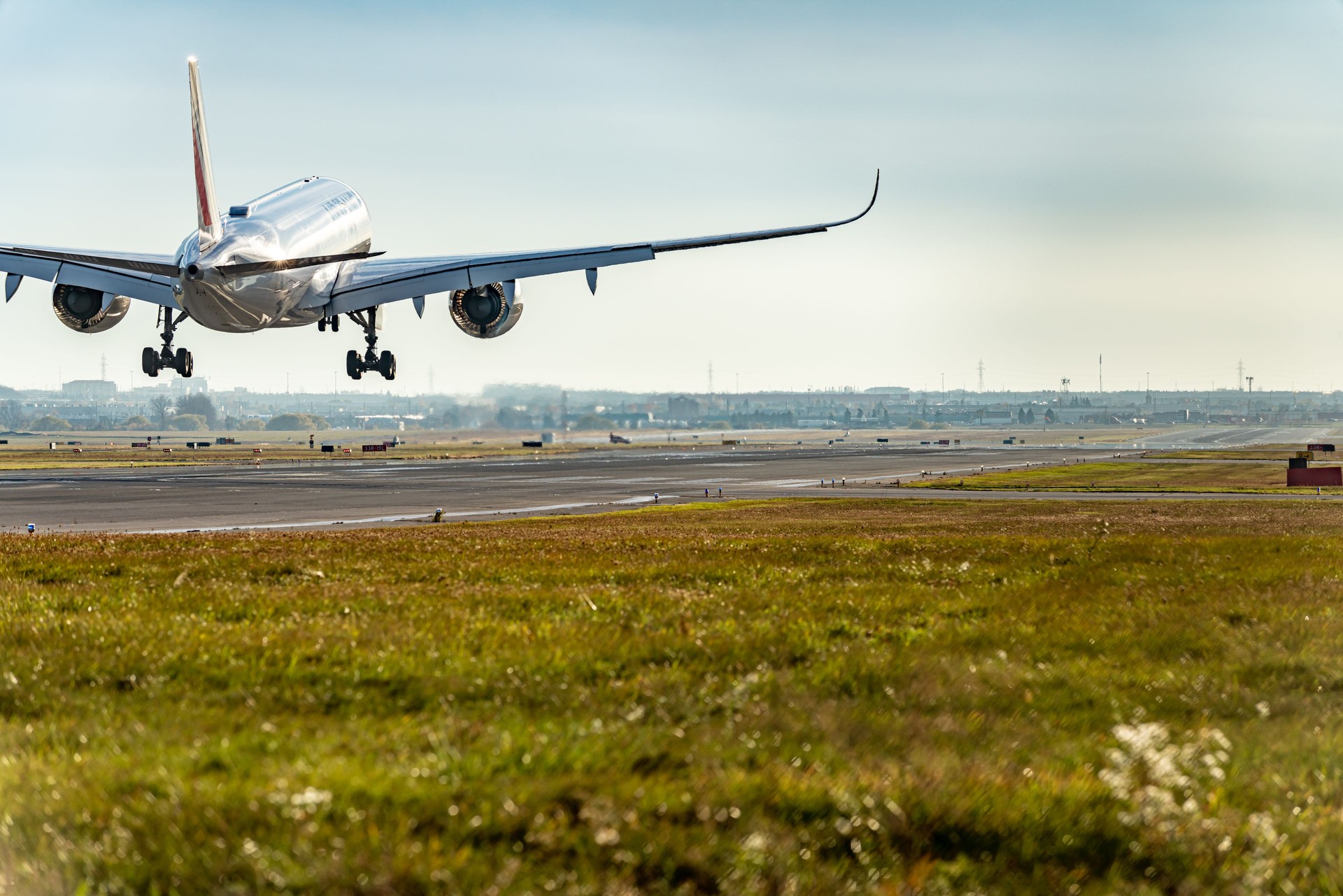 Airplane landing on runway in Pearson International airport at dusk, Toronto,Canada