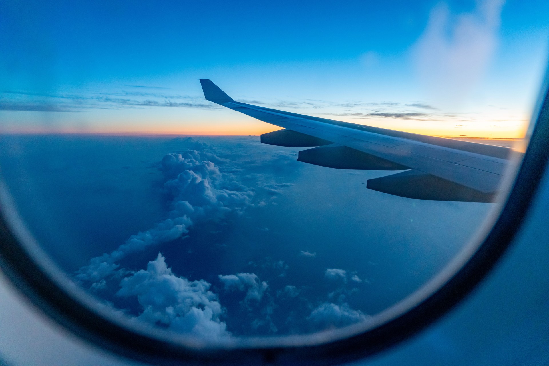 Flying above the clouds at dusk