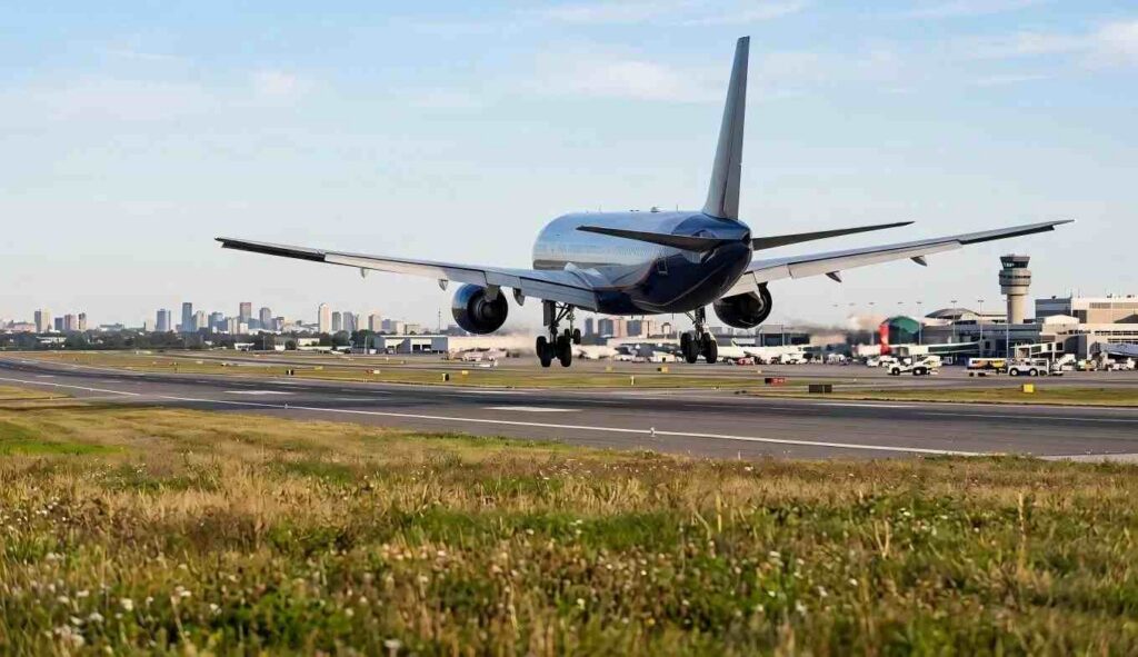 airplane landing on runway in pearson international airport at dusk torontocanada